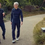 John Ternus and Tim Cook walking together at Apple Park